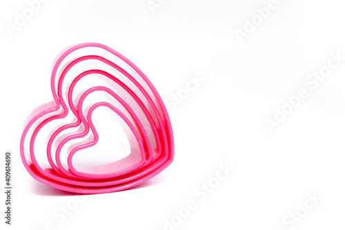 Plastic pink molds for making cookies in the shape of a hearts