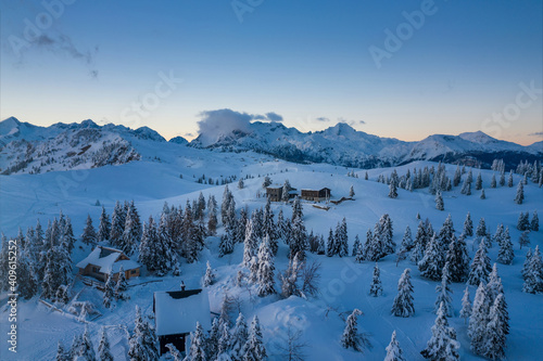 Velika planina with shepherds huts covered in snow at winter.