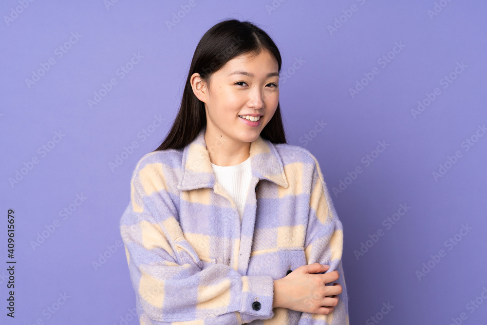 Young asian woman isolated on purple background laughing Young asian woman isolated on purple background laughing