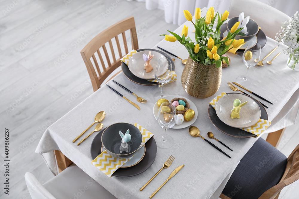 Fototapeta premium Beautiful Easter table setting with festive decor indoors, above view