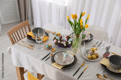 Beautiful Easter table setting with festive decor indoors