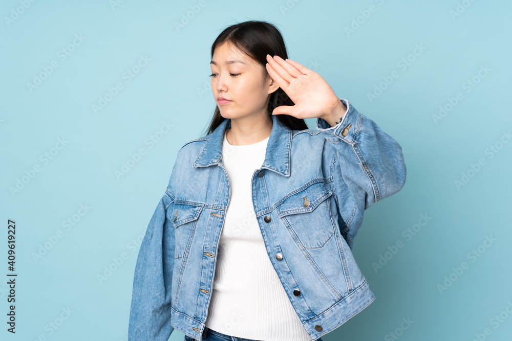 Young asian woman isolated on background making stop gesture and disappointed Young asian woman isolated on background making stop gesture and disappointed