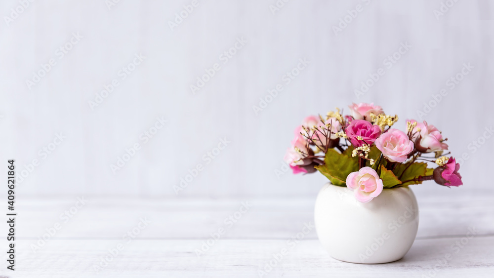 pink rose flower on wood shelf white background. copy space for text. Still life and Lifestyle Concept pink rose flower on wood shelf white background. copy space for text. Still life and Lifestyle Concept