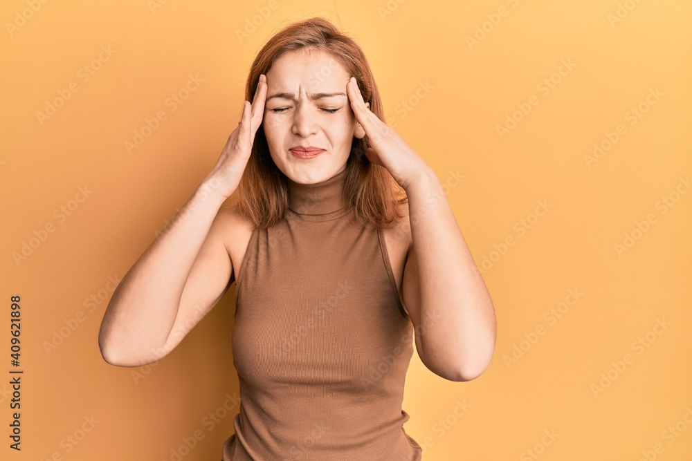 Young caucasian woman wearing casual style with sleeveless dress with hand on head, headache because stress. suffering migraine. Young caucasian woman wearing casual style with sleeveless dress with hand on head, headache because stress. suffering migraine.