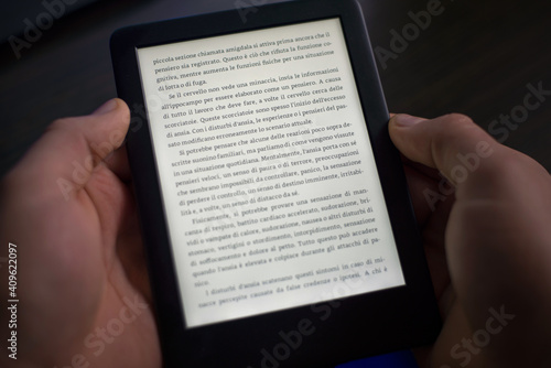 The person is reading the digital book.