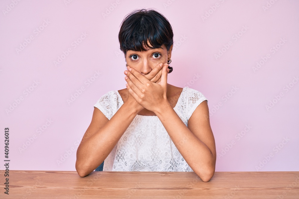 Beautiful brunettte woman wearing casual clothes over pink background shocked covering mouth with hands for mistake. secret concept. Beautiful brunettte woman wearing casual clothes over pink background shocked covering mouth with hands for mistake. secret concept.