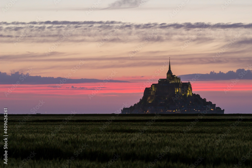 Mont Saint Michel at sunset in Normandy, France.