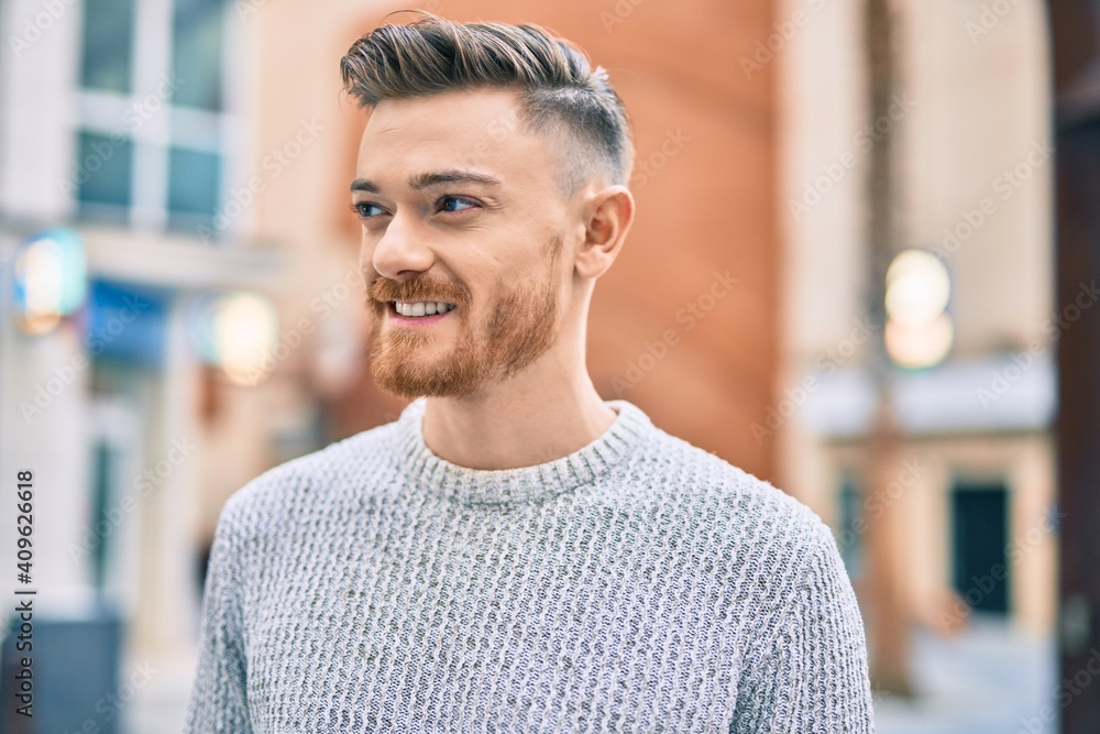 Young caucasian man smiling happy standing at the city. Young caucasian man smiling happy standing at the city.