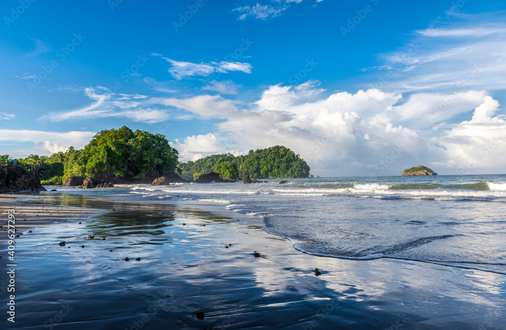Manuel Antonio beatiful tropical beach with white sand and blue ocean. Paradise. National Park in Costa Rica, Central America. Manuel Antonio beatiful tropical beach with white sand and blue ocean. Paradise. National Park in Costa Rica, Central America.
