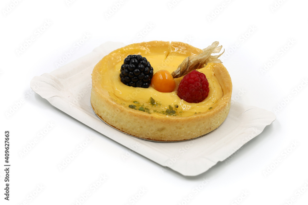 delicious mini cake with fresh fruits of physalis, blackberry and raspberry on paper plate isolated on white delicious mini cake with fresh fruits of physalis, blackberry and raspberry on paper plate isolated on white