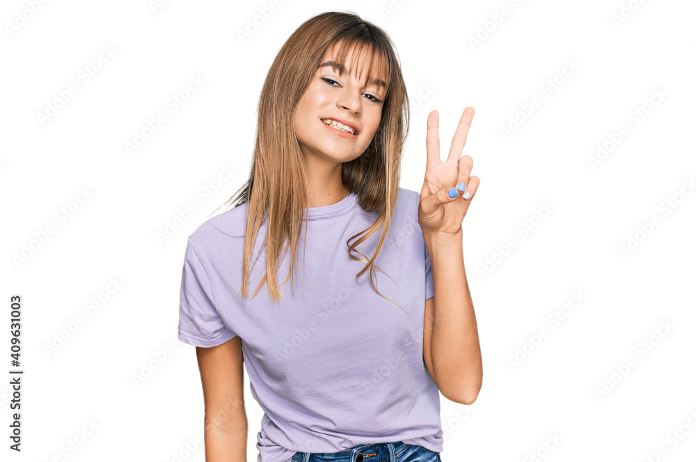 Teenager caucasian girl wearing casual clothes showing and pointing up with fingers number two while smiling confident and happy. Teenager caucasian girl wearing casual clothes showing and pointing up with fingers number two while smiling confident and happy.