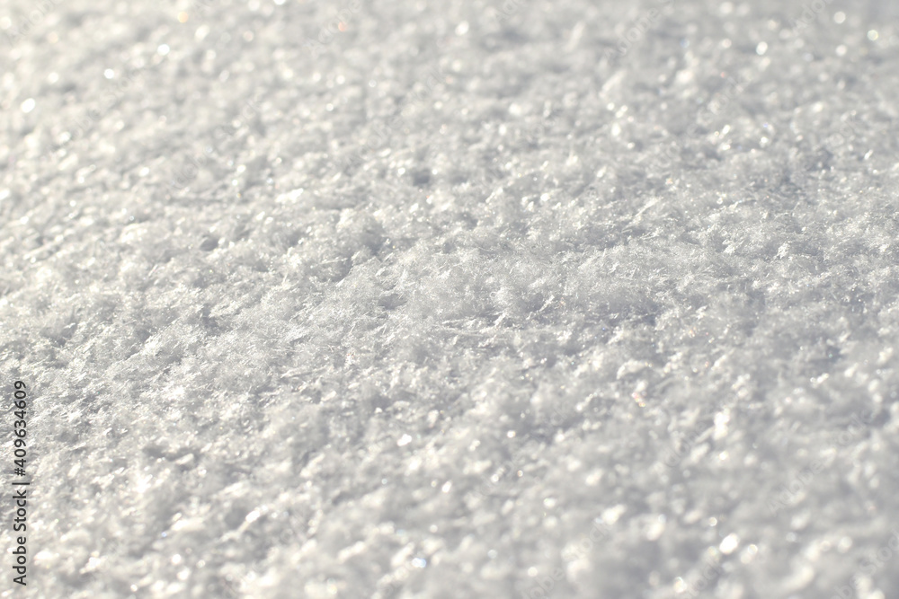 White snow texture on clear day. Winter background. Snow drifts. white snowflakes background, rough pattern of snow texture White snow texture on clear day. Winter background. Snow drifts. white snowflakes background, rough pattern of snow texture
