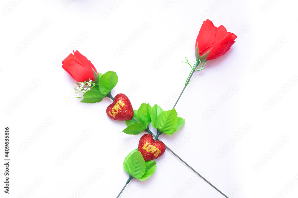 Valentine's Day background. Two red roses on a white background. Valentine's Day background. Two red roses on a white background.