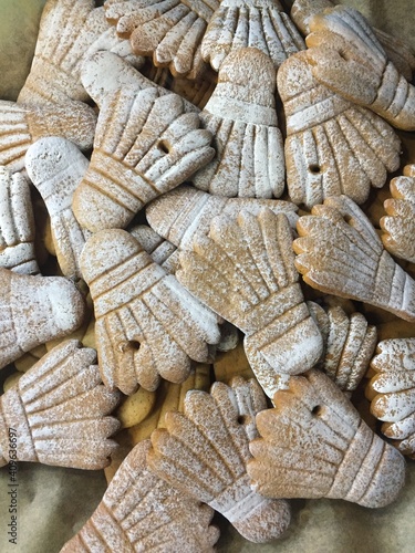 many gingerbread badminton shuttlecock with powdered sugar, background