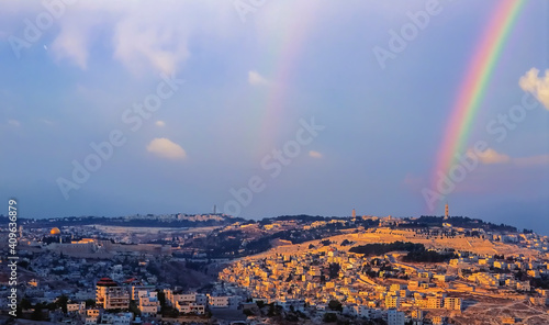 Double rainbow over Mount of Olives, with panoramic view from the Old city with Dome of the Rock on Temple Mount, Mount Scopus, the churches of Ascension to the arab villages in the Kidron valley photo