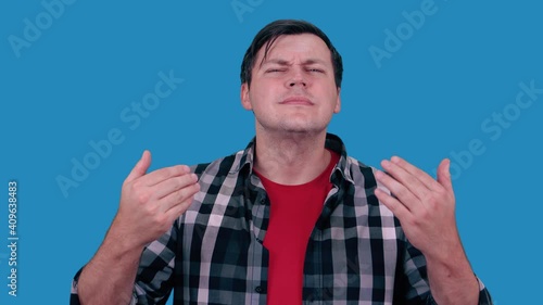 A portrait of a man smells good. Positive human facial expressions, emotions, feelings, reaction, attitude, behavior, perception.