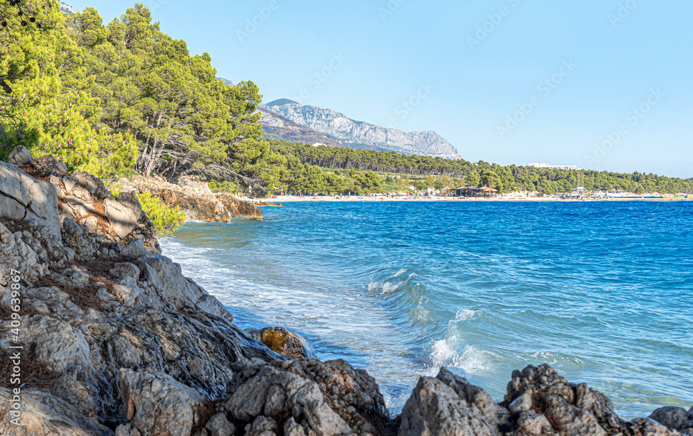 Sea shore. Stone coastline against the backdrop of the beautiful blue sea. Adriatic.