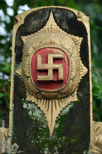 Indonesia Bali - Ubud  ancient religious swastika symbol - right-facing or clockwise icon