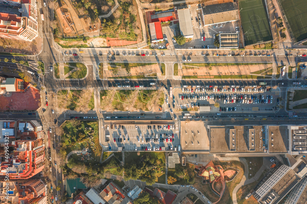 Aerial overhead drone shot of parking lot near Turo de la Rovira in Barcelona morning