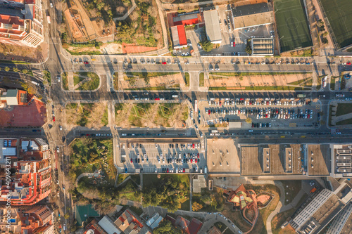 Aerial overhead drone shot of parking lot near Turo de la Rovira in Barcelona morning