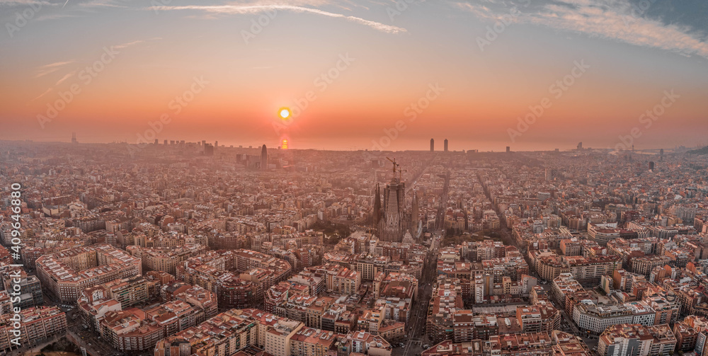 Panoramic aerial drone shot of Barcelona center with beach sunrise