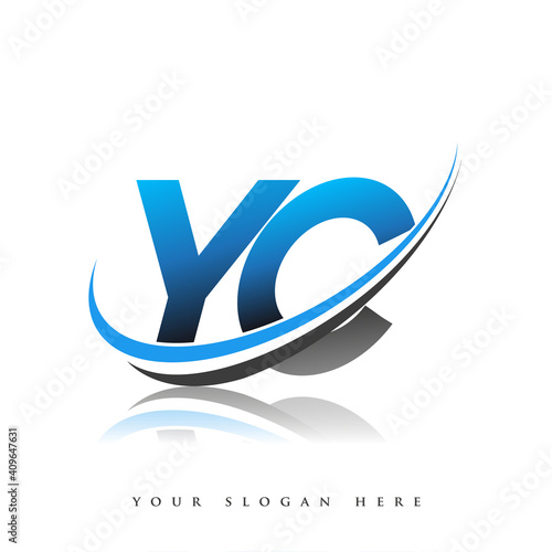 YC initial logo company name colored blue and black swoosh design, isolated on white background. vector logo for business and company identity. photo