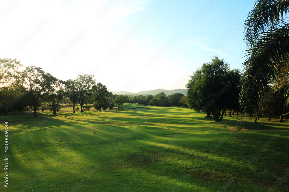 Naklejka premium beautiful golf course at the sunset, sunrise time. , morning time