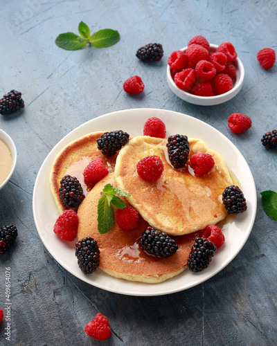 Morning breakfast Pancakes with fresh berry and honey. Healthy food