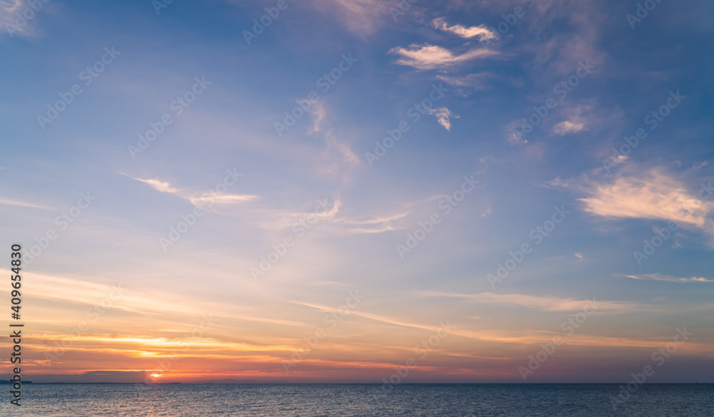 Sunset sky over sea in the evening with colorful sunlight cloud, Dusk sky