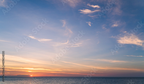 Sunset sky over sea in the evening with colorful sunlight cloud, Dusk sky