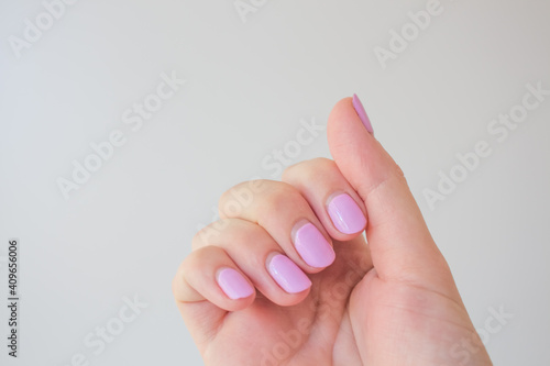 Regrown manicure. Female hand with regrown nails before correcting gel polish. Well-groomed hands. copy space trending. Place for text © Natali