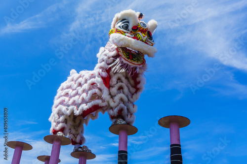 Lion dance and confetti during Chinese New Year celebration photo