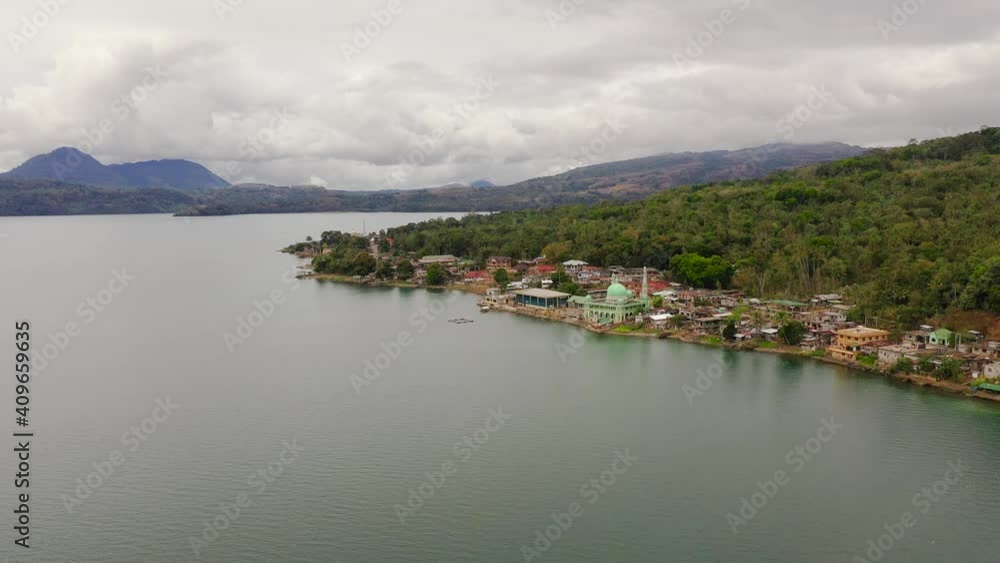 Aerial view of Mosque on the shore of lake Lanao. Mindanao, Lanao del Sur, Philippines. Aerial view of Mosque on the shore of lake Lanao. Mindanao, Lanao del Sur, Philippines.