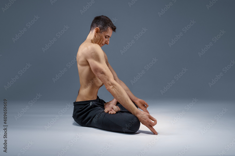 Male yoga maditates in classical pose Male yoga maditates in classical pose
