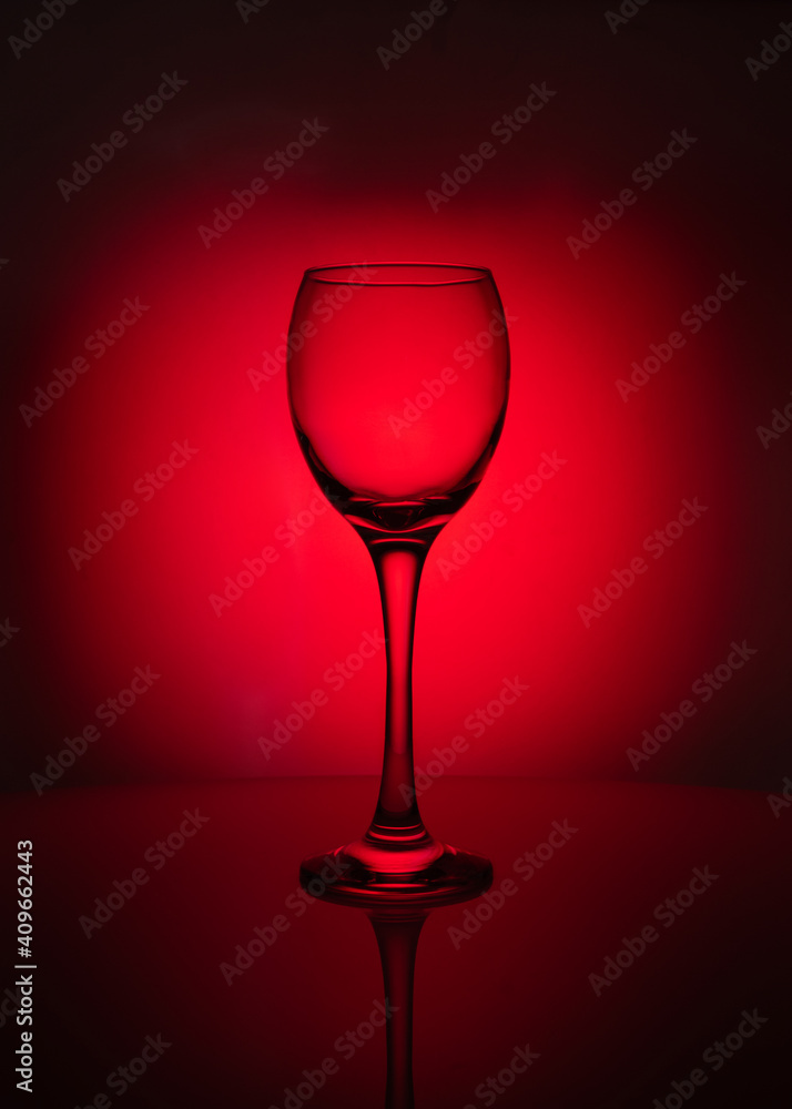 silhouette of transparent glass on red background silhouette of transparent glass on red background