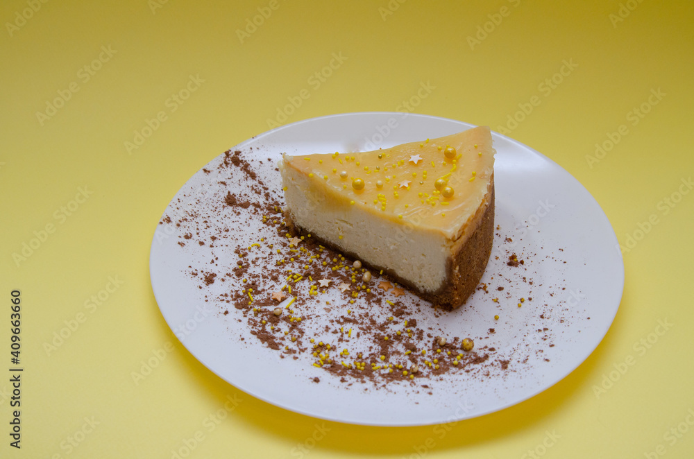 Lemon cheesecake in a white plate with cocoa decoration