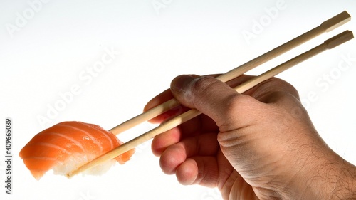 Salmon sushi nigiri in bamboo sticks