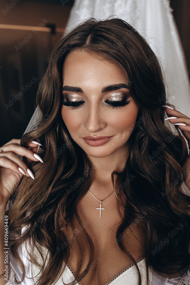 Fototapeta premium Morning of the bride. Preparing the bride for the upcoming wedding. Portrait of a girl.