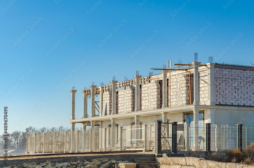 Fototapeta premium Construction of a stone two-story house.