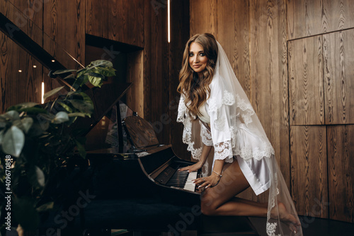 Portrait of the bride. Wedding preparations. The girl at the piano.