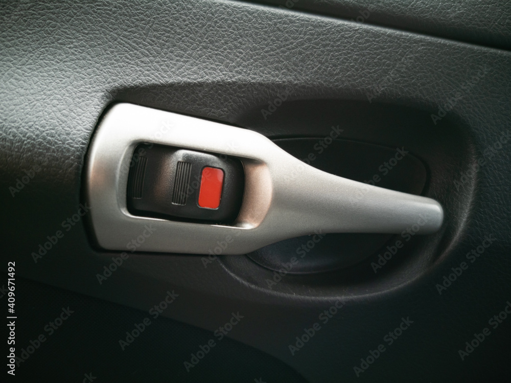 Mechanical door lock handle in automobile interior. Mechanical door lock handle in automobile interior.