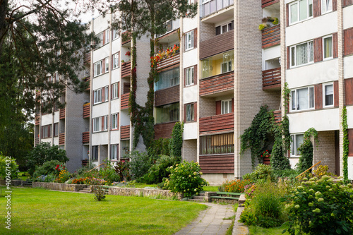 Four storey, residential block of flats house (Khrushchyovka) with cozy garden.