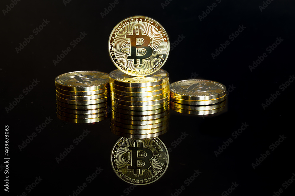 Golden bitcoins stacked as a winner podium. Golden bitcoins stacked as a winner podium.