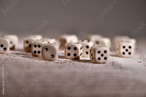 a bunch of dice on handwritten pages. Concept of destiny already written: predestination 