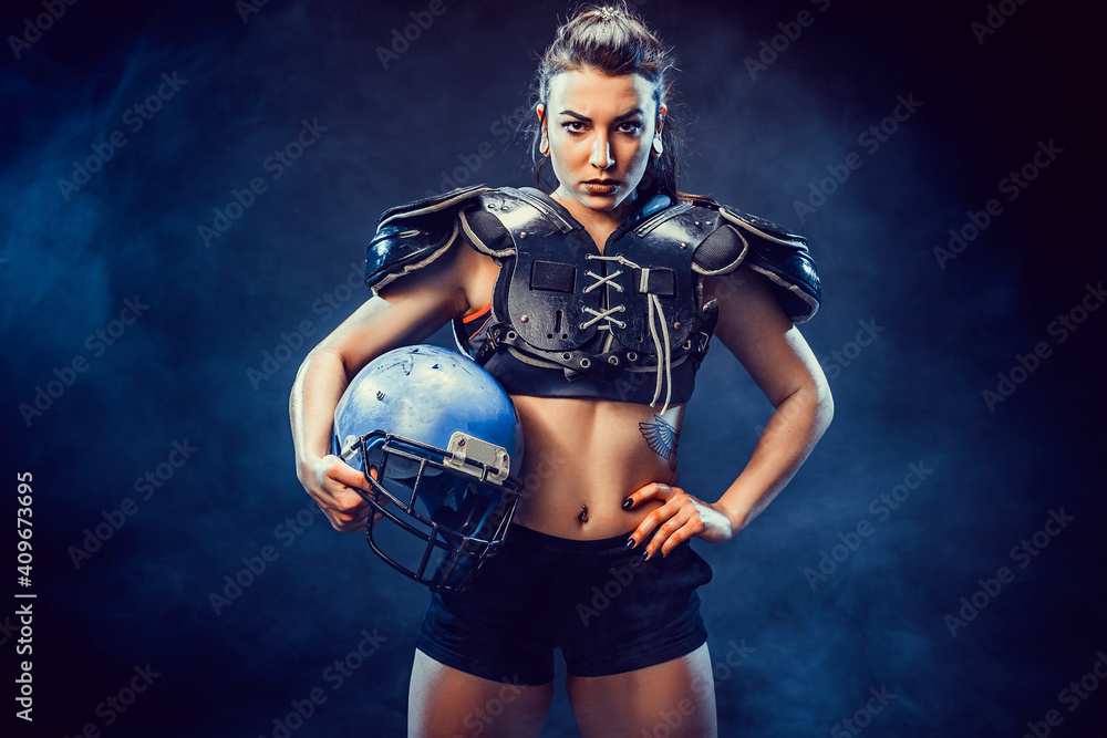 Young brunette wearing sexy uniform of rugby football player posing. Young brunette wearing sexy uniform of rugby football player posing.