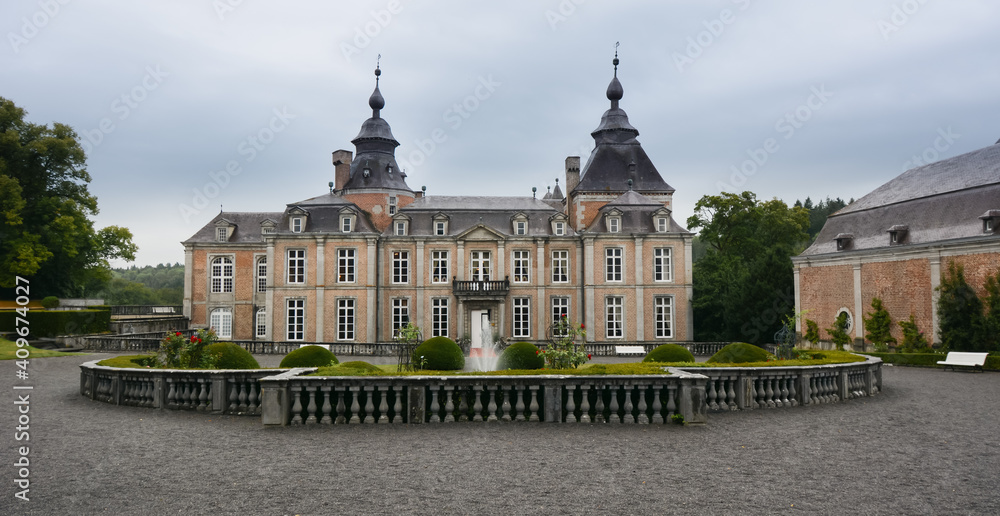 Modave Castle, Belgium. View of fountain and main facade.