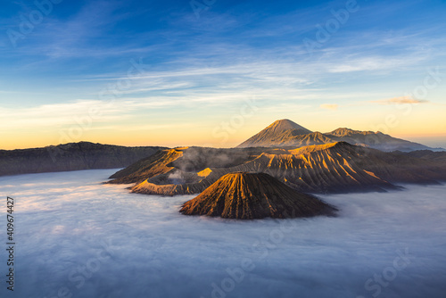 Bromo volcano mountaion at sunrise in East Java, Indonesia surrounded by morning fog.