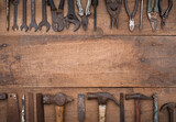 Collection of antique woodworking handtools on a rough workbench old wooden with blank copy space
