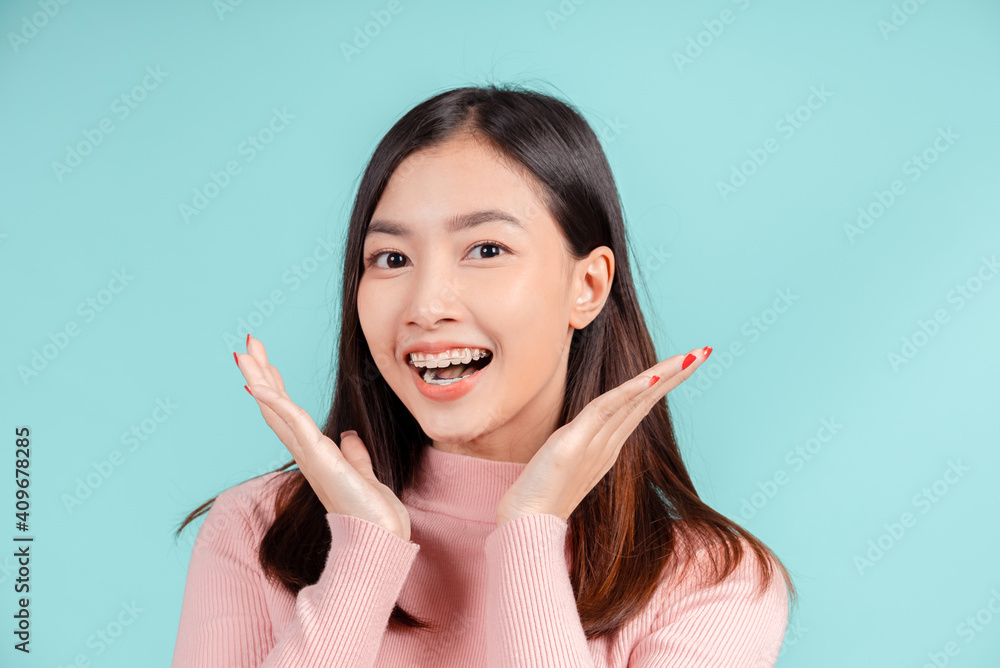 Dental braces of young asian woman wearing retainer braces glad emotion