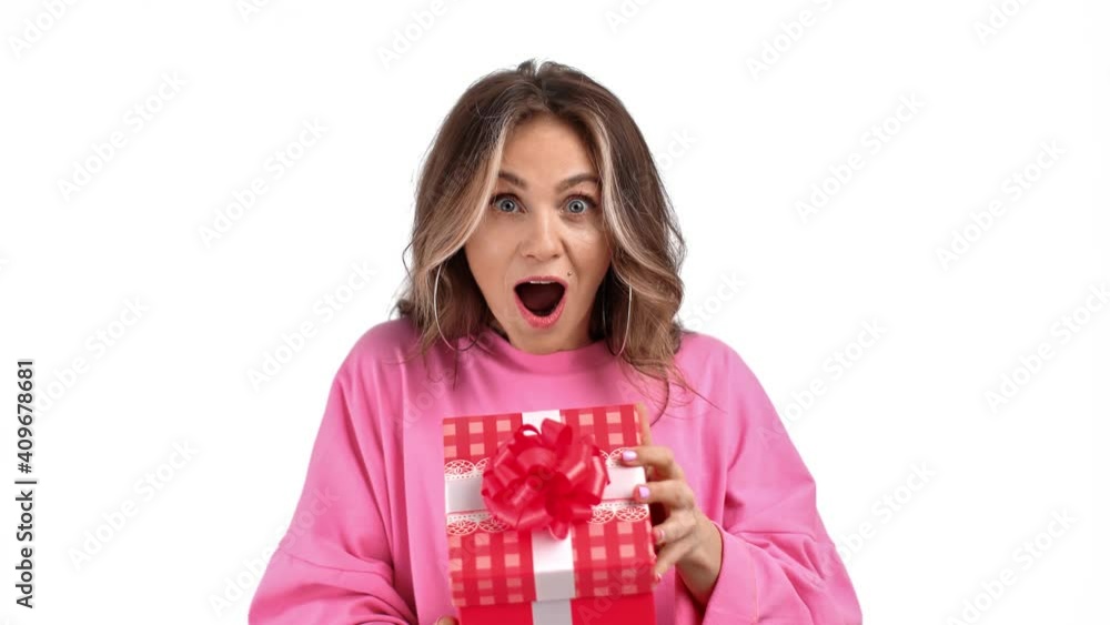 Portrait rejoicing lady opening gift box with desired present. Medium close up shot on 4k RED camera Portrait rejoicing lady opening gift box with desired present. Medium close up shot on 4k RED camera
